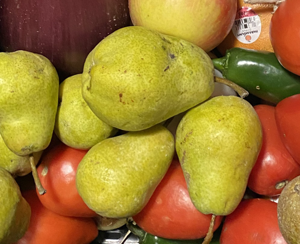 Several green pears and red apples.